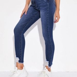 High-rise frayed skinny jeans